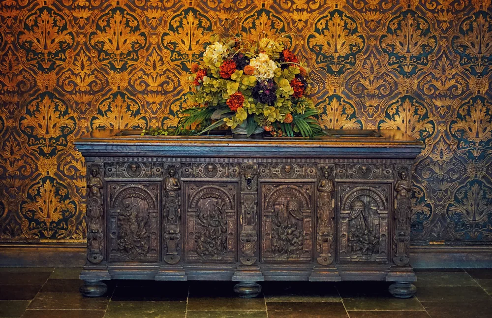 A dark carved sideboard